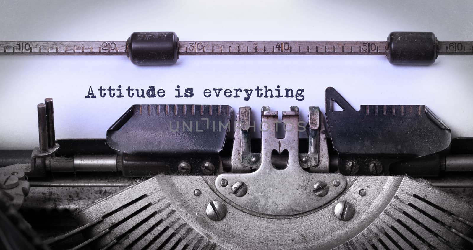 Vintage inscription made by old typewriter, attitude is everything