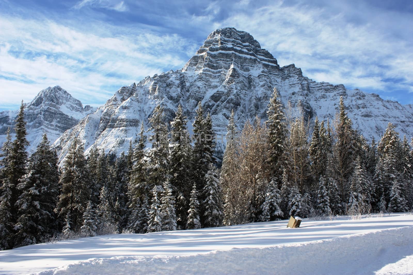 Canadian mountain peak under a blue sky by chrisga