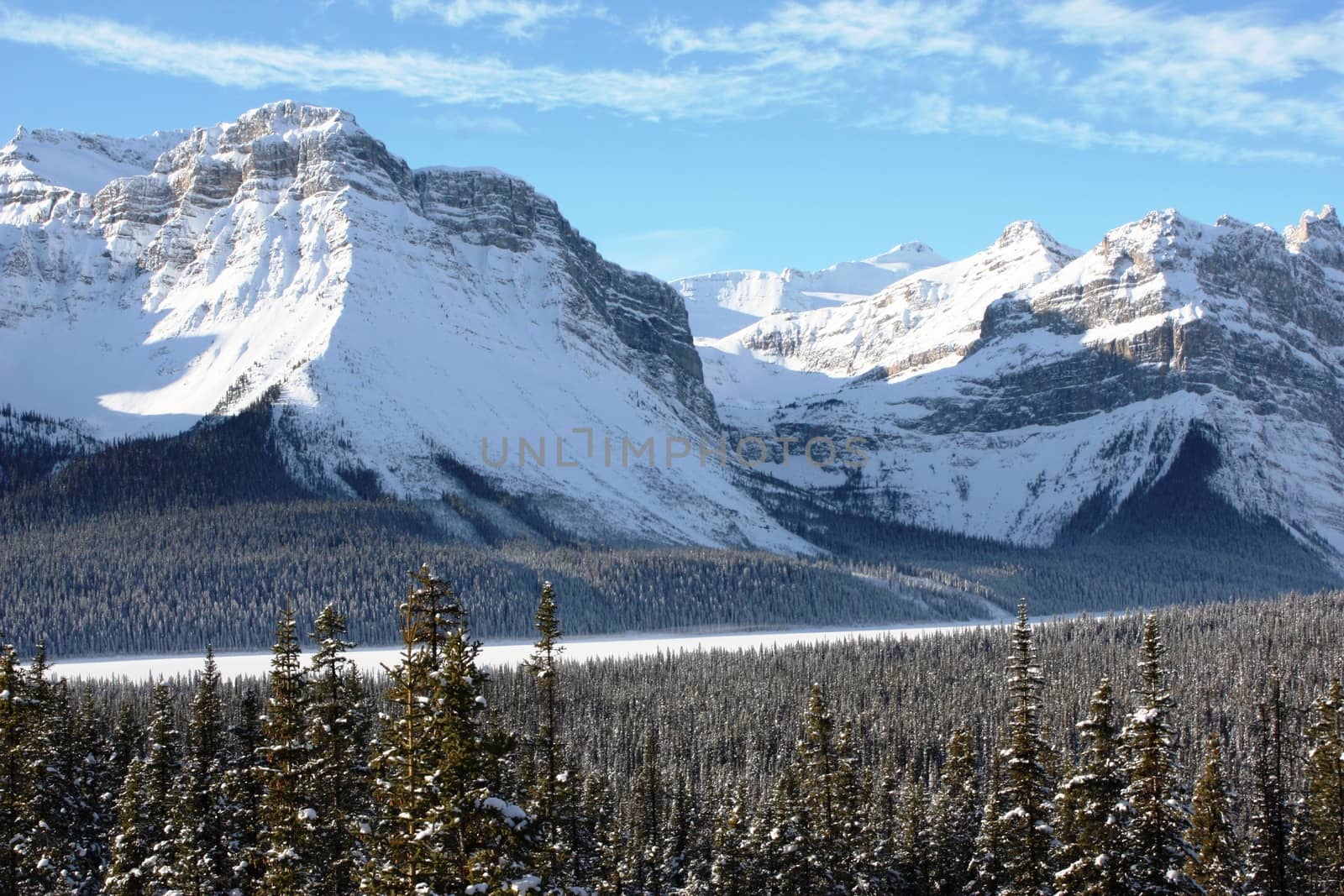 Canadian mountain peak under a blue sky by chrisga