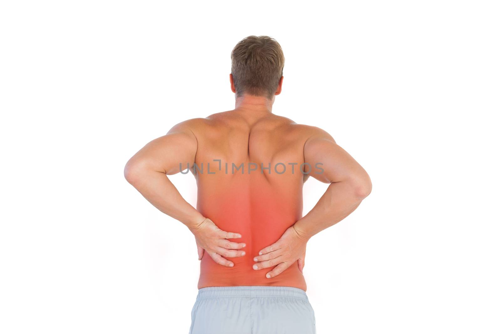 Shirtless man suffering from lower back pain by Wavebreakmedia