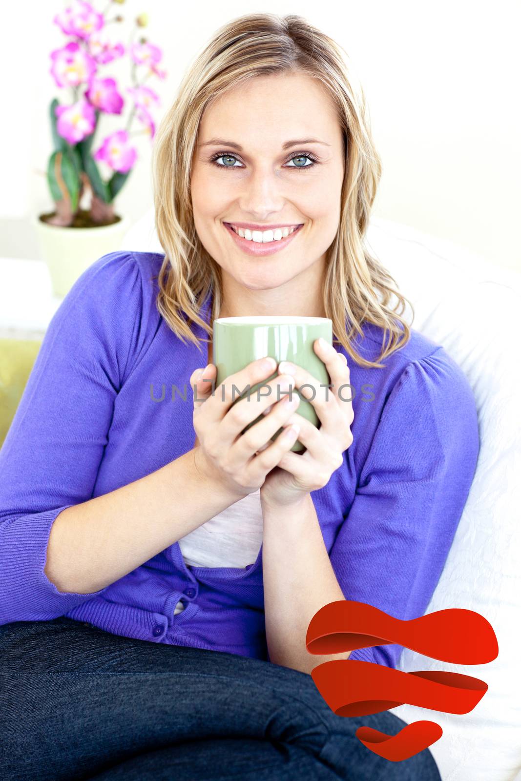 Blond woman enjoying her coffee sitting on the sofa in the livingroom against heart