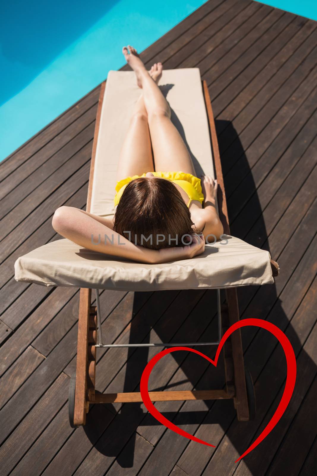 Composite image of beautiful woman in bikini relaxing by pool by Wavebreakmedia