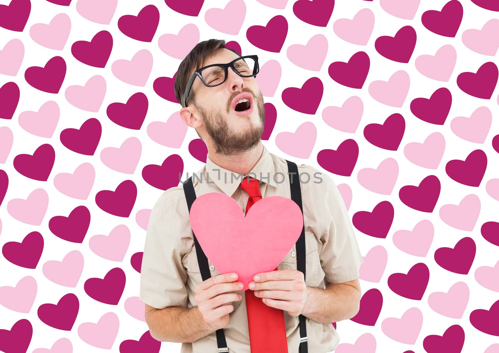 Geeky hipster crying and holding heart card against valentines day pattern