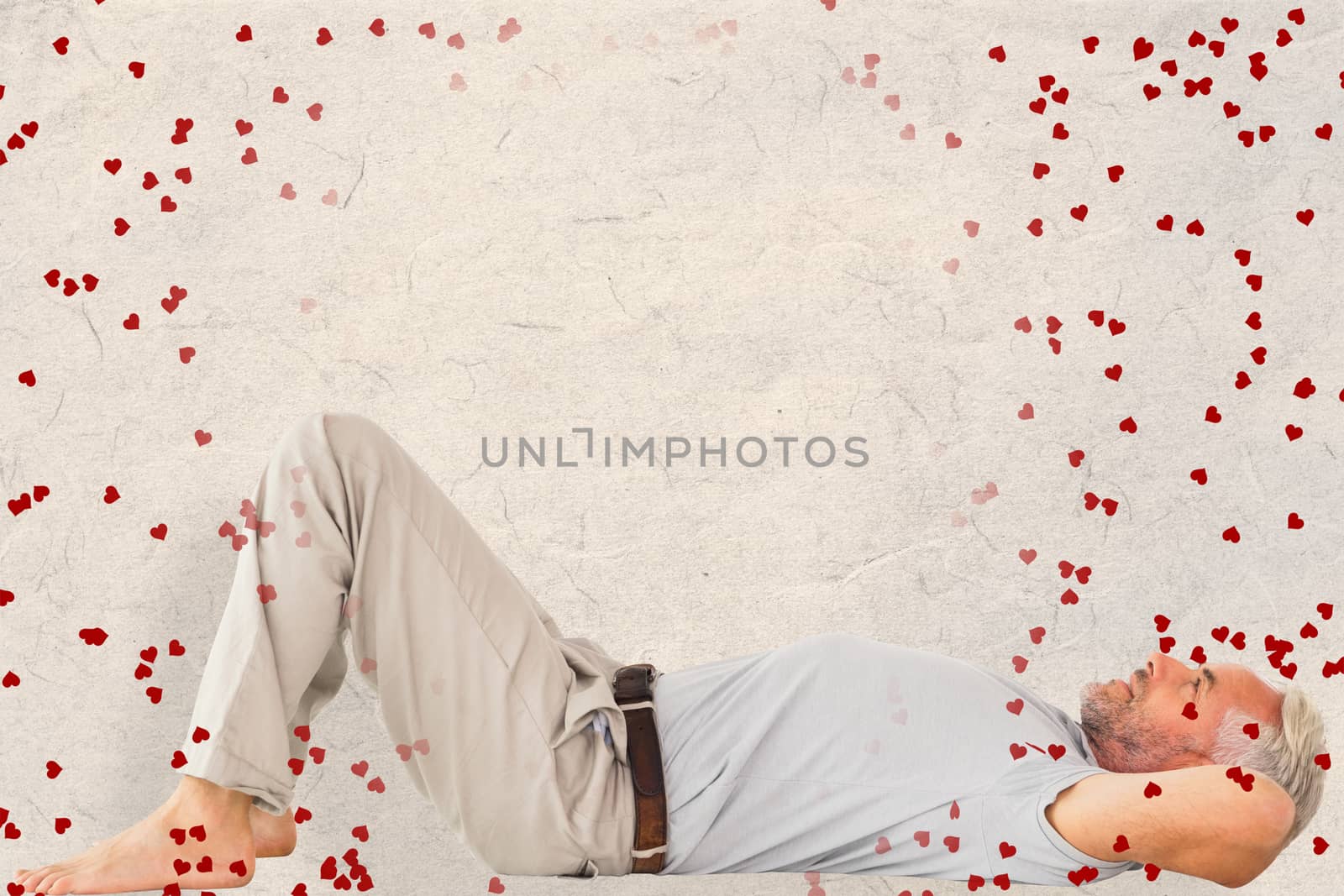 Composite image of smiling man lying and looking up by Wavebreakmedia