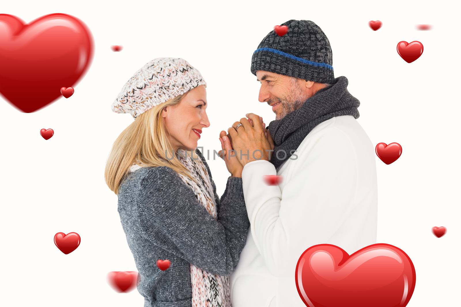 Composite image of couple in winter fashion embracing by Wavebreakmedia
