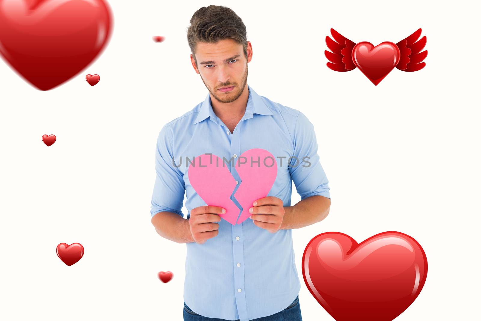 Composite image of sad man holding a broken heart by Wavebreakmedia