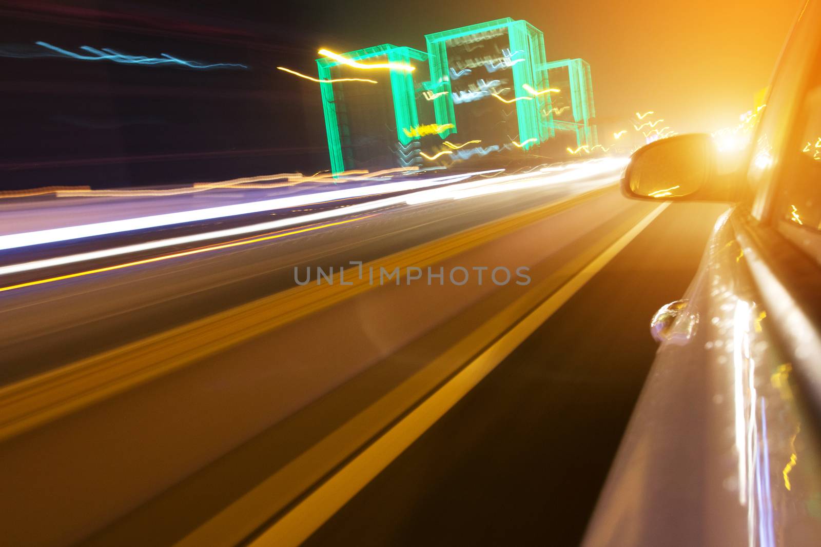 driving car in the night, view from side of car,blurred motion
