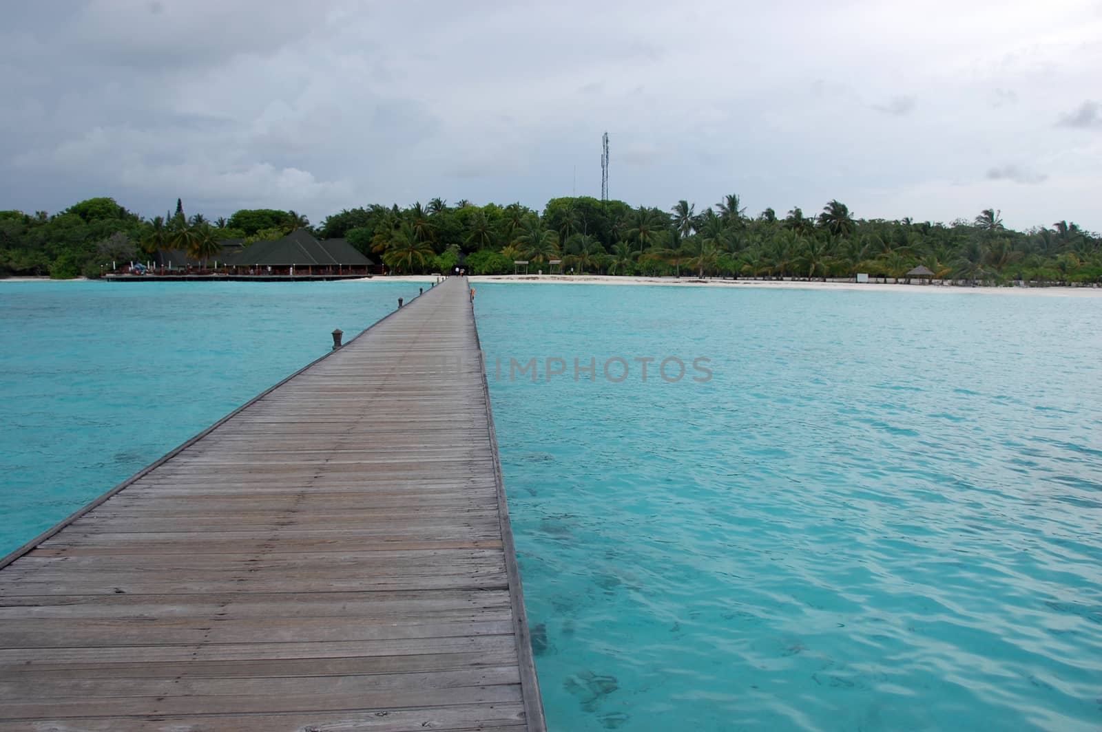 Timber pier at Maldives island by danemo