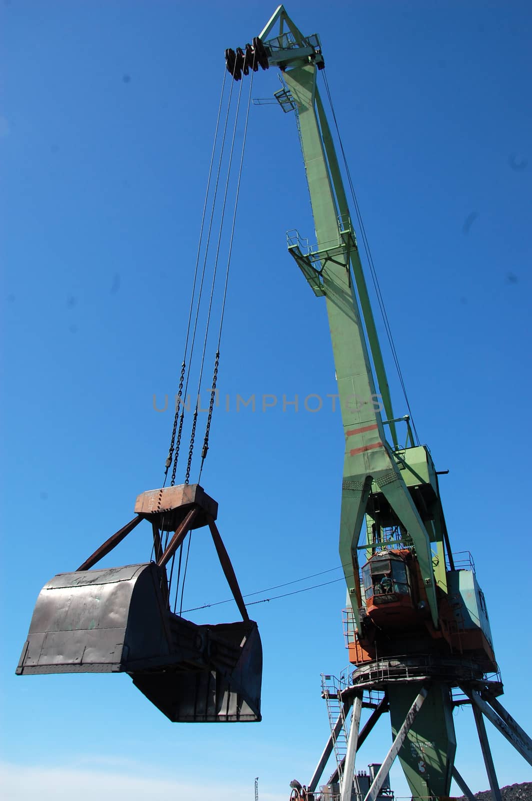 River port cargo crane loading coal, Kolyma, Russia