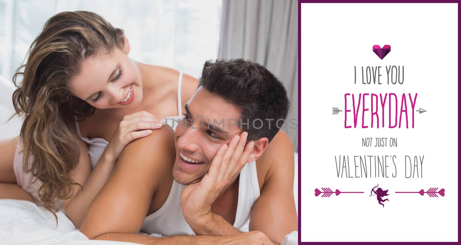 Romantic young couple in bed at home against valentines day greeting