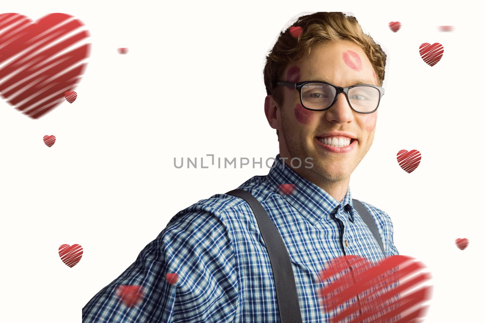 Composite image of geeky hipster covered in kisses by Wavebreakmedia