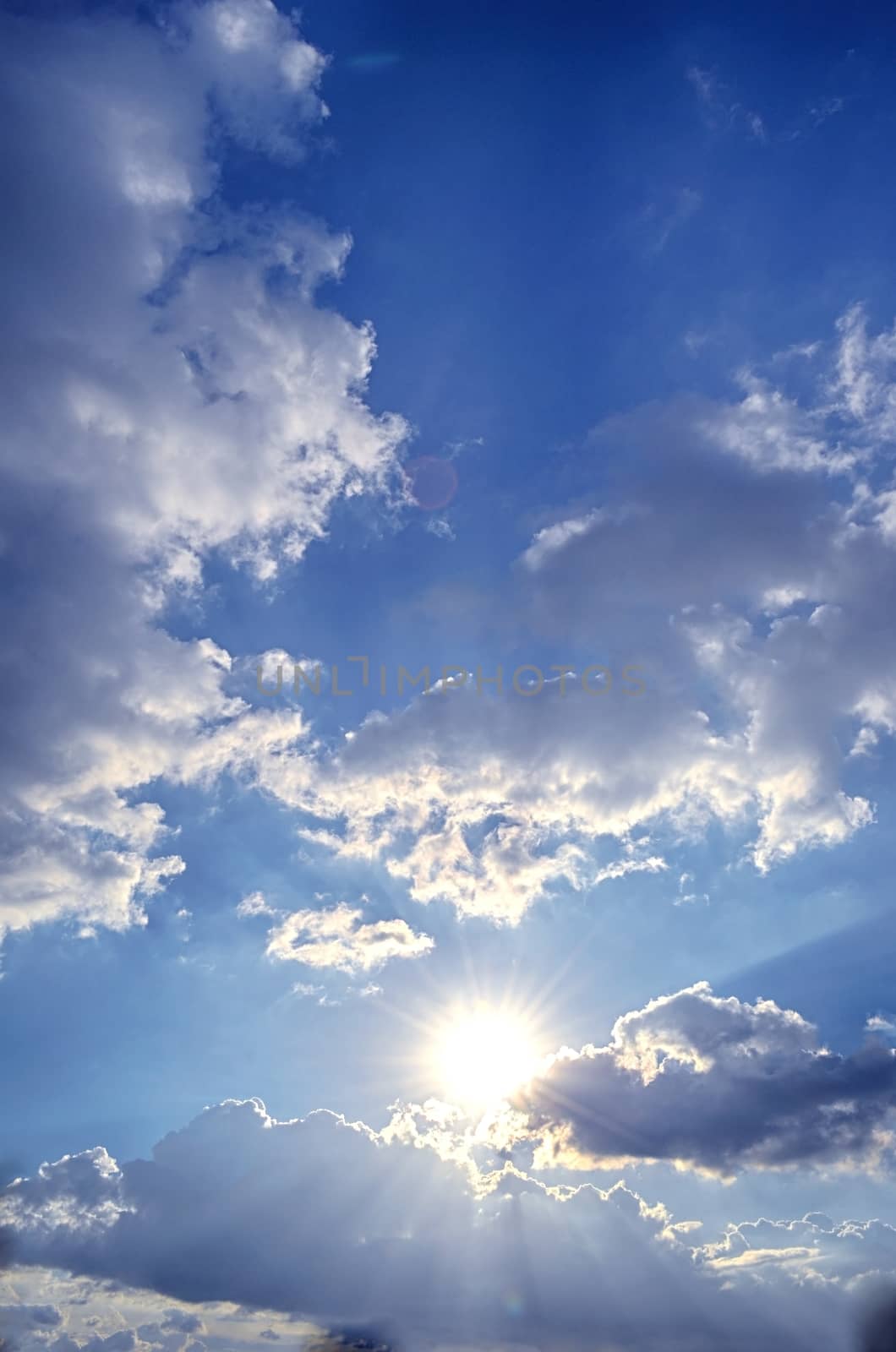 Blue sky with white cloud and sun