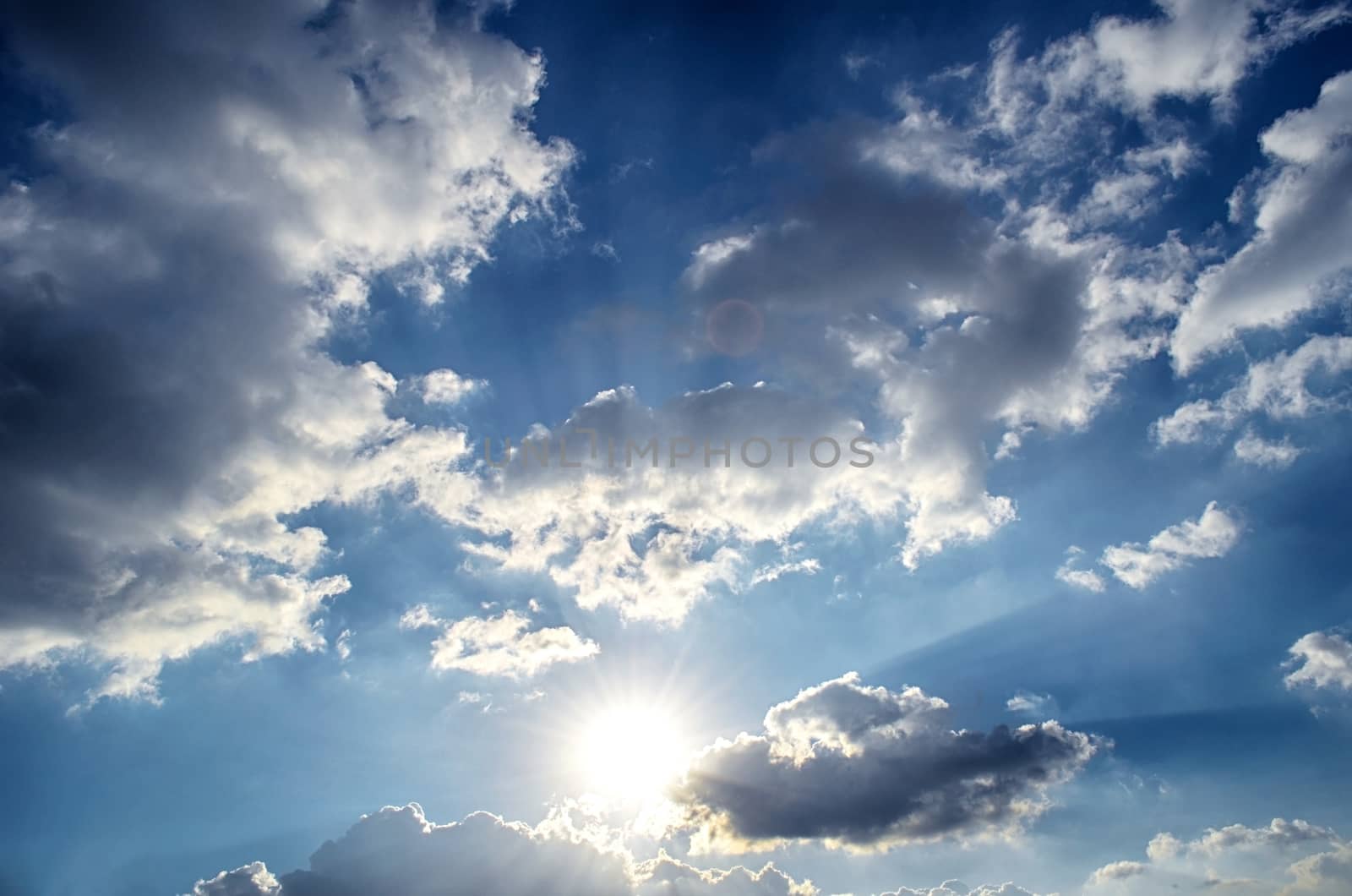 Blue sky with white cloud and sun