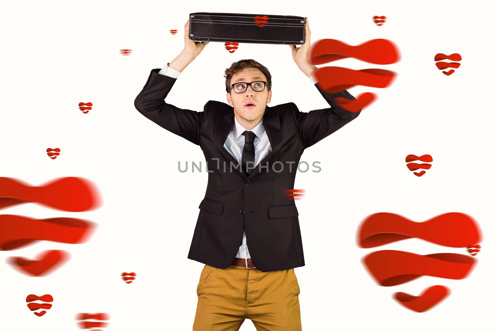 Young geeky businessman holding briefcase against hearts