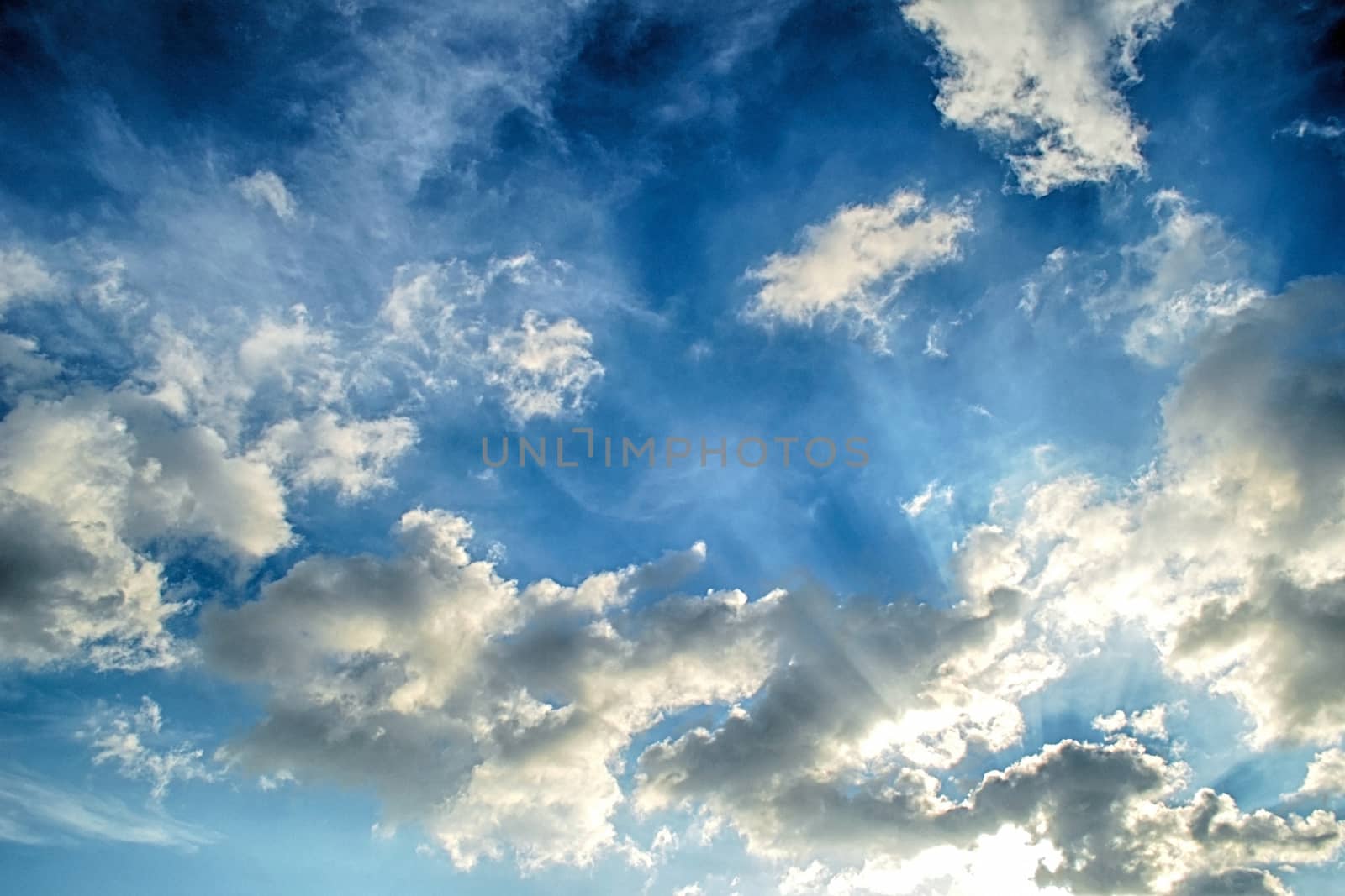 Blue sky with white cloud and sun