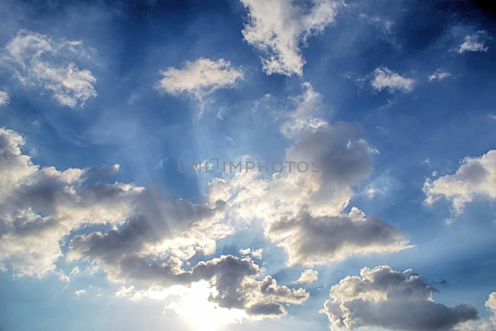 Blue sky with white cloud and sun