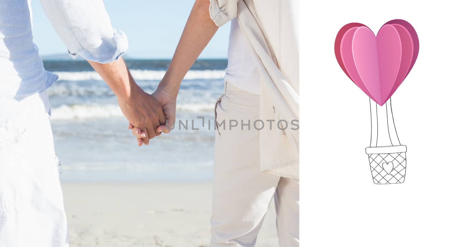 Couple on the beach looking out to sea holding hands against heart hot air balloon