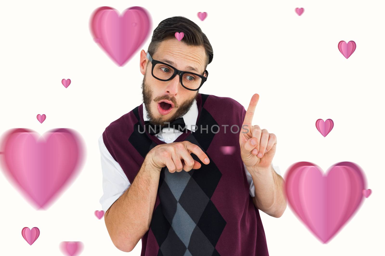 Geeky hipster in sweater vest pointing  against hearts