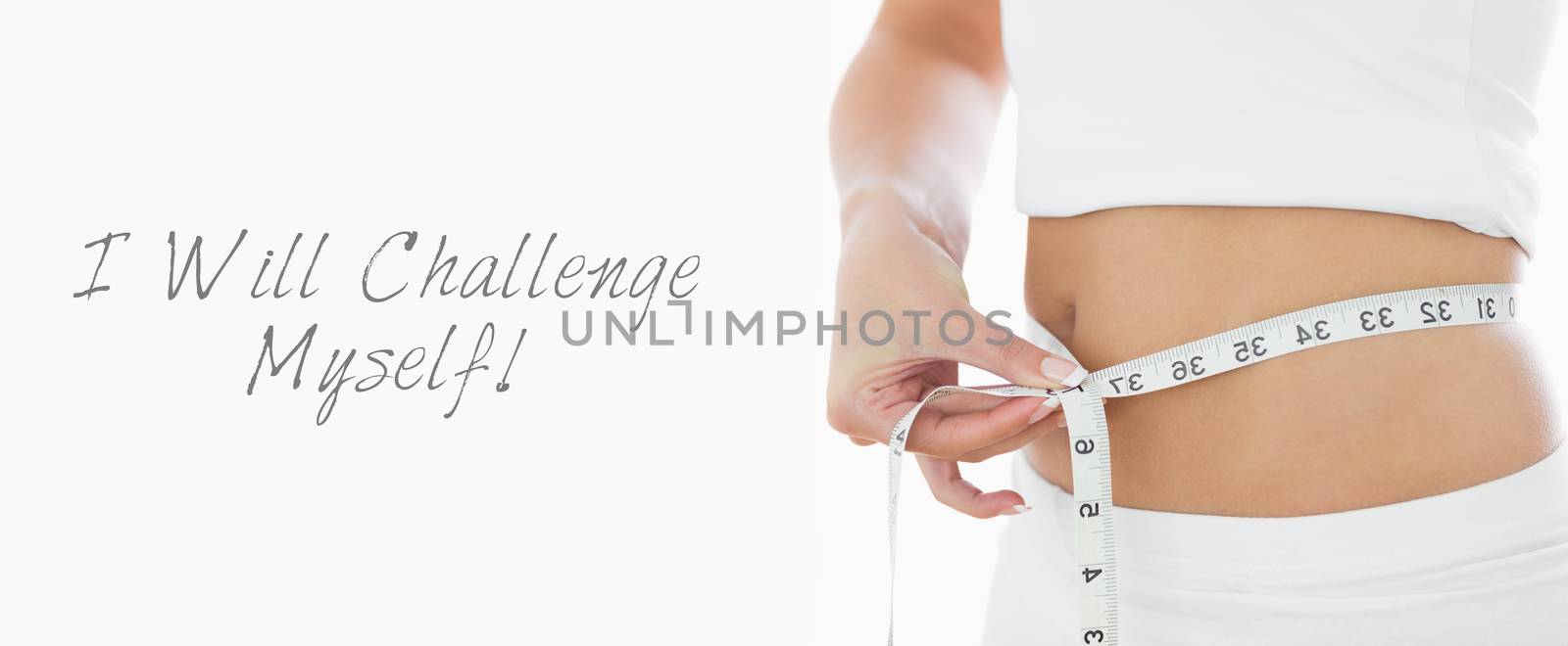 Closeup midsection of woman measuring waist over white background