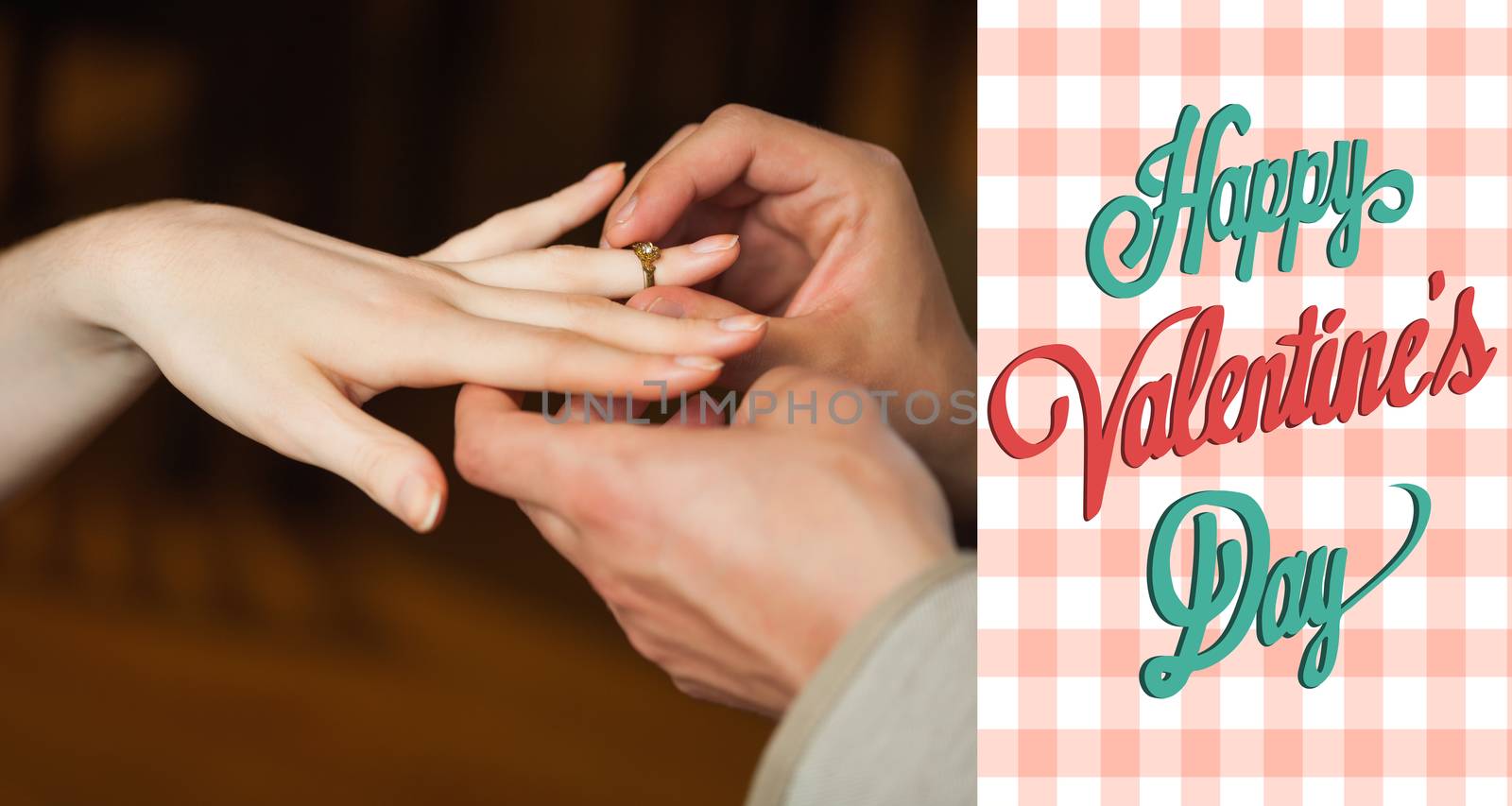 Close up on man putting on ring during marriage proposal against happy valentines day