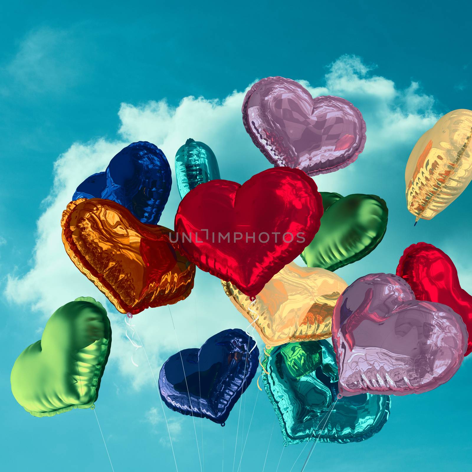 Heart balloons against cloudy sky