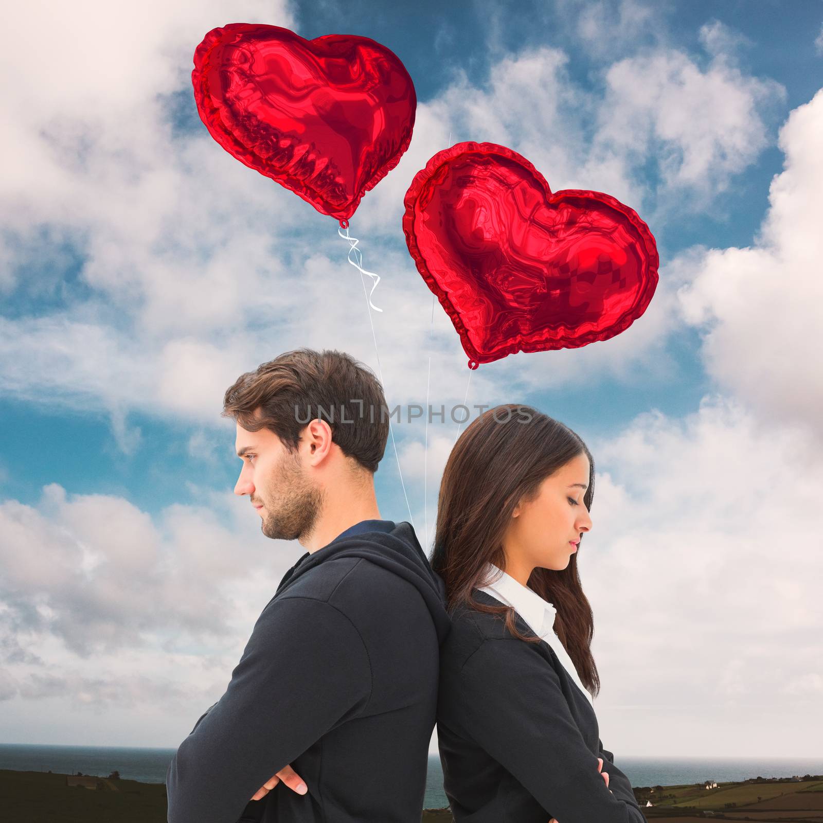 Unhappy couple not speaking to each other  against blue sky with white clouds