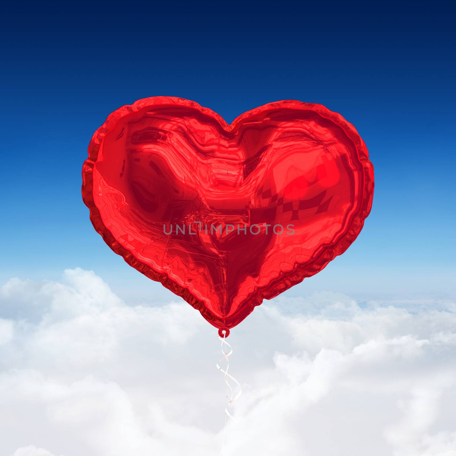 Red heart balloon against blue sky over clouds