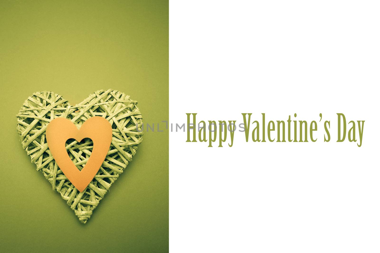 Wicker heart ornament with green paper cut out against cute valentines message