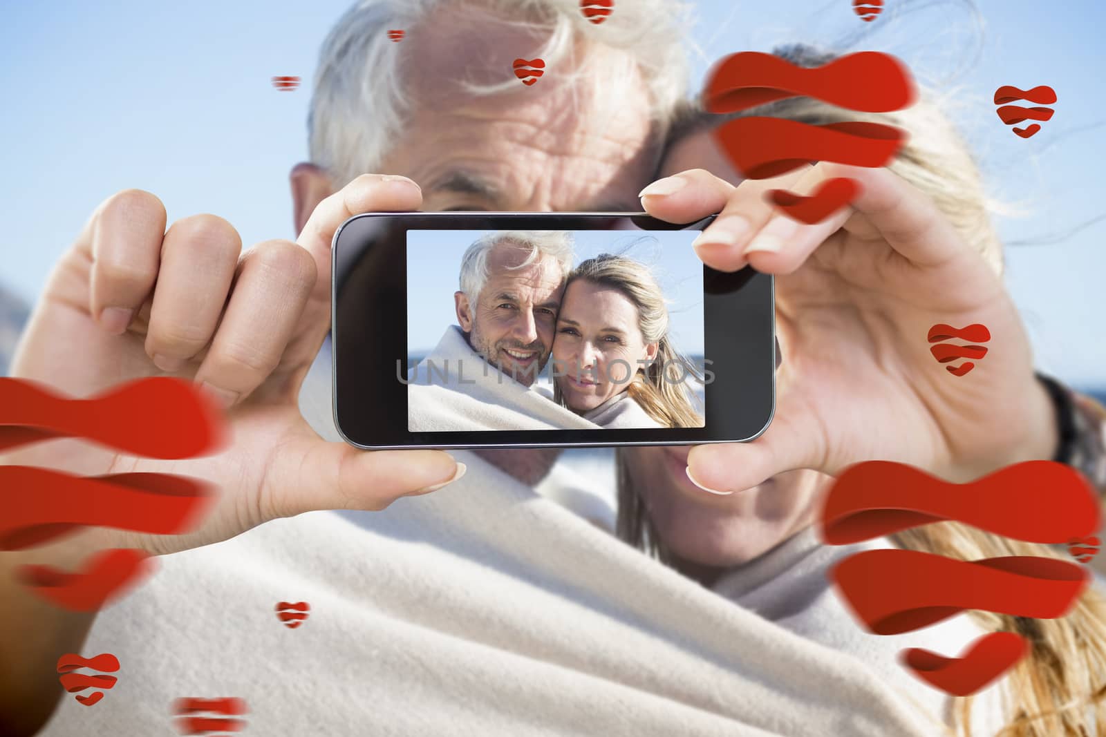 Composite image of valentines couple taking a selfie