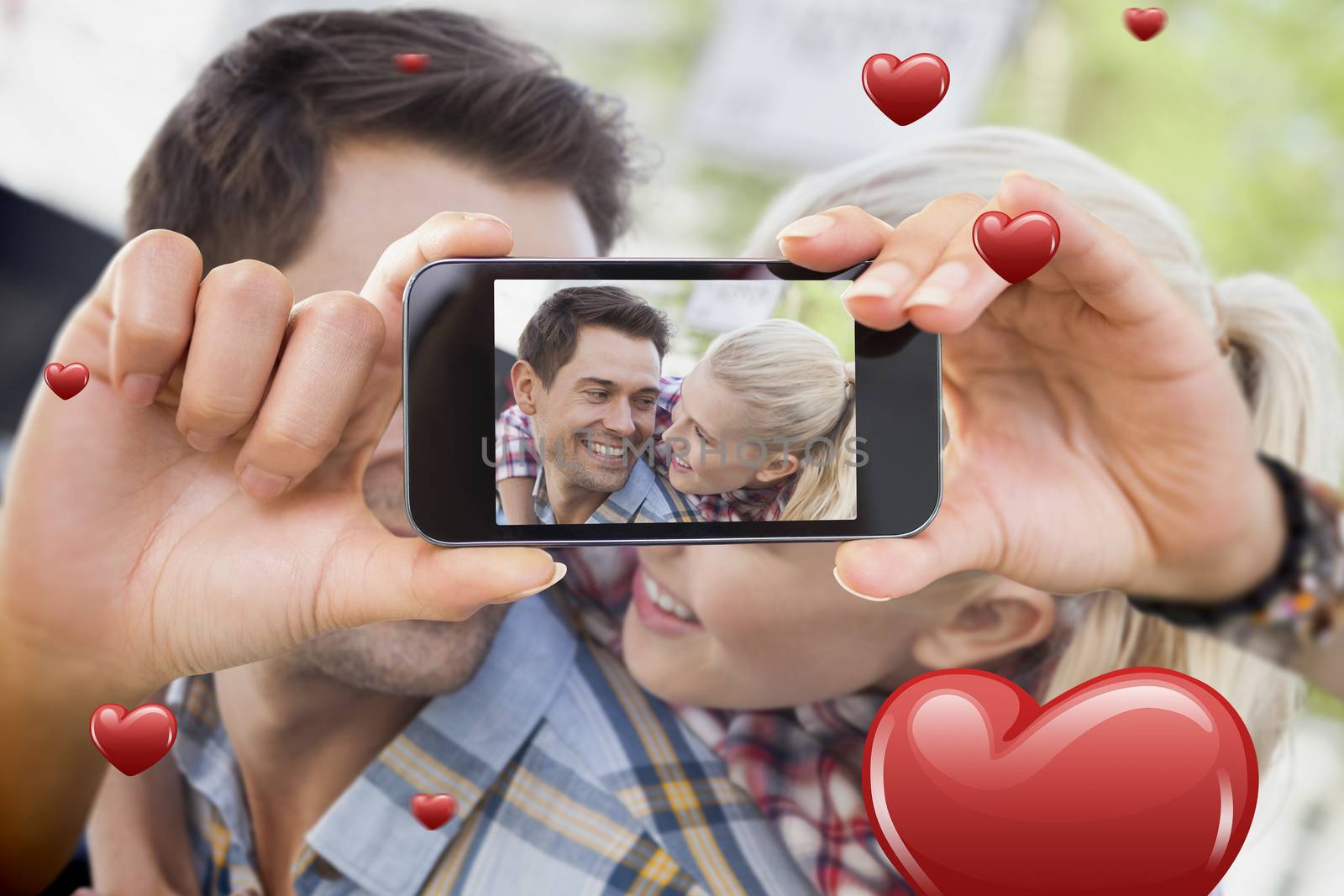 Composite image of valentines couple taking a selfie