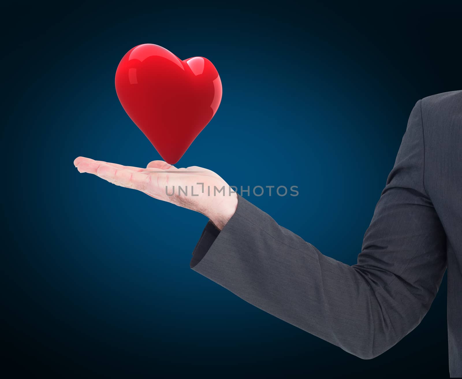 Businessman with his hand out against blue background with vignette