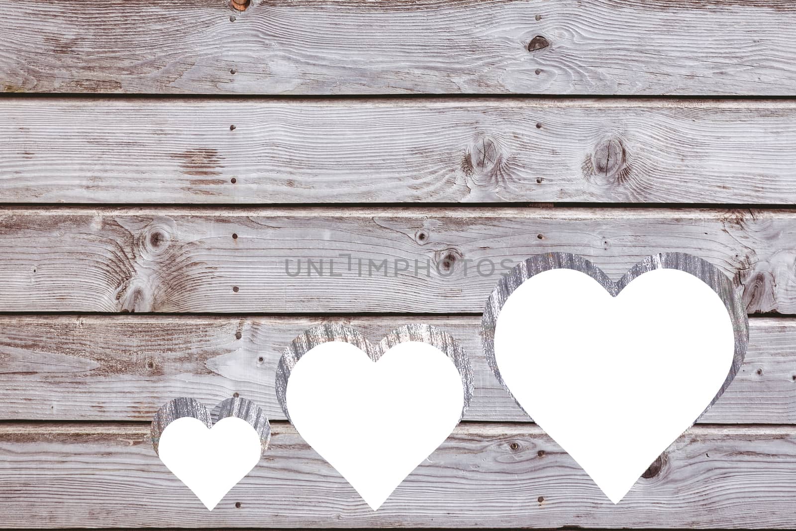Hearts cut out in wood by Wavebreakmedia