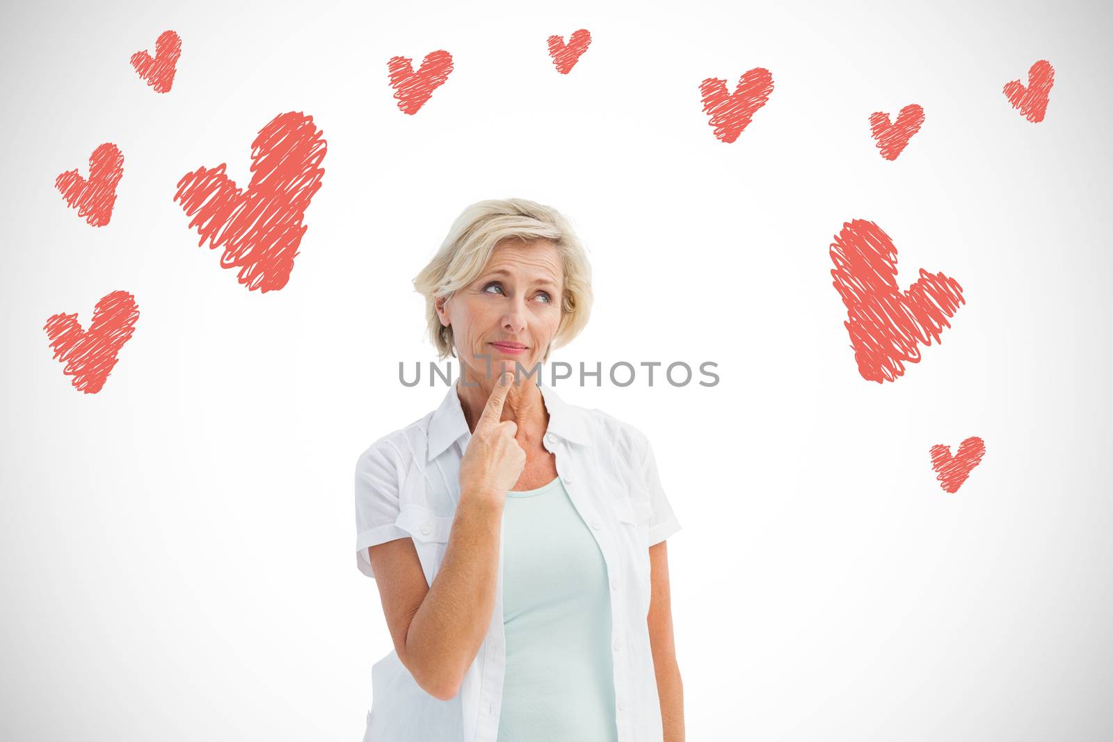 Mature woman thinking with hand on chin against white background with vignette