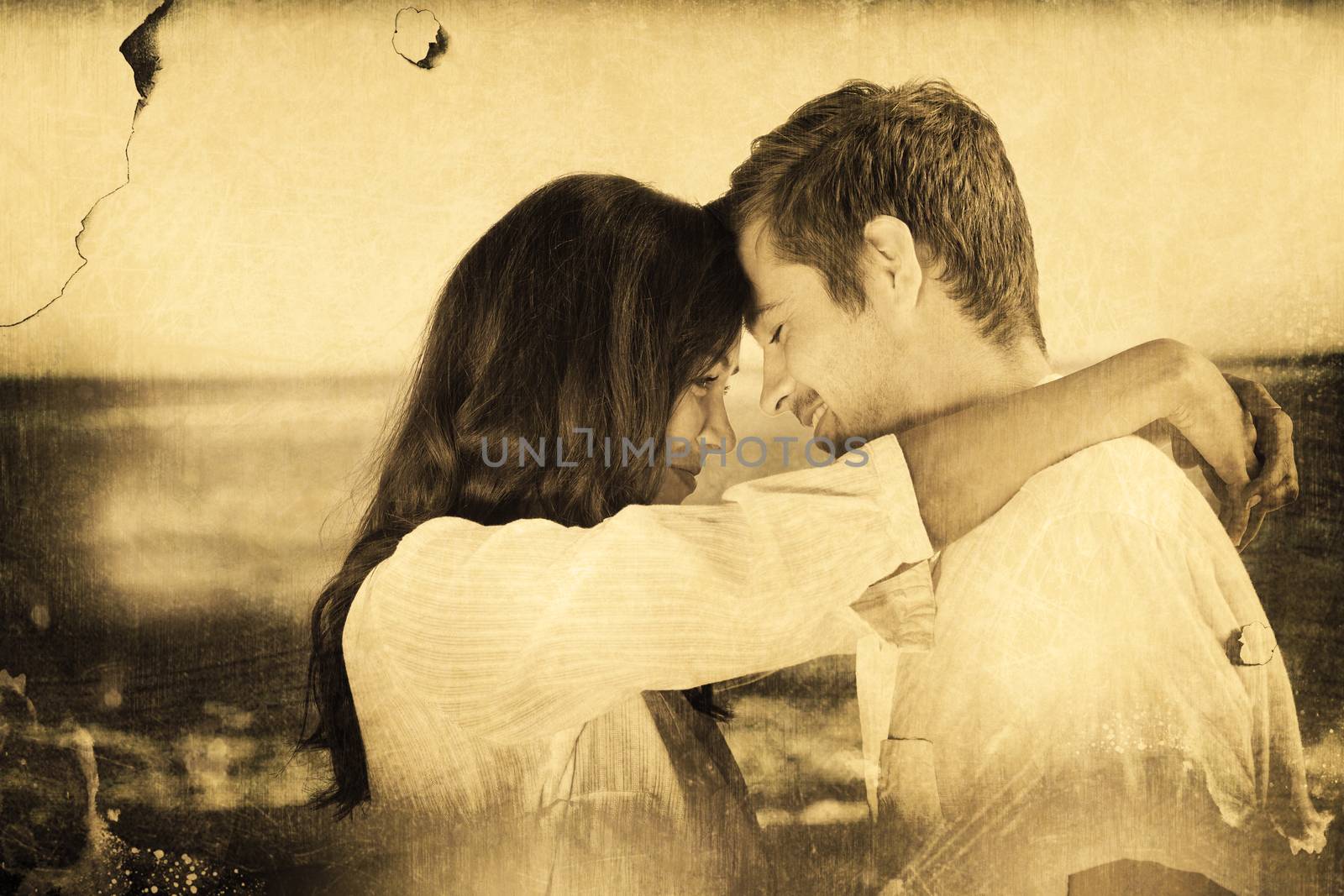 Couple embracing each other on the beach against grey background