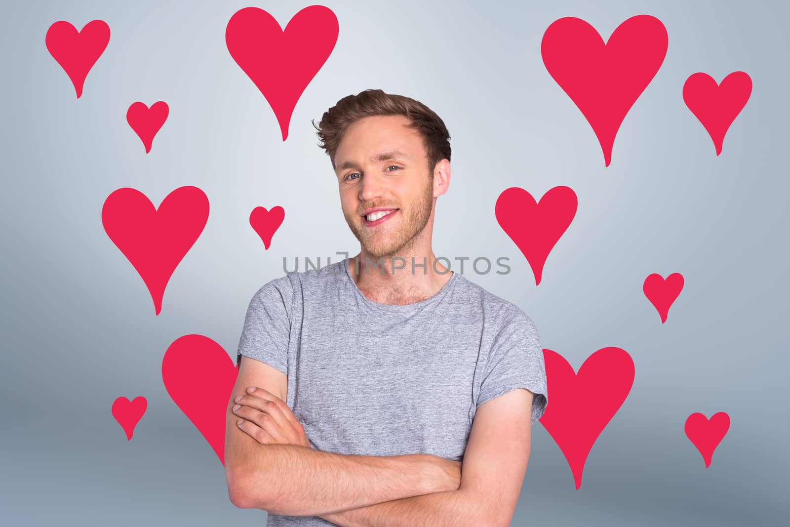 Composite image of smiling young man with arms crossed by Wavebreakmedia