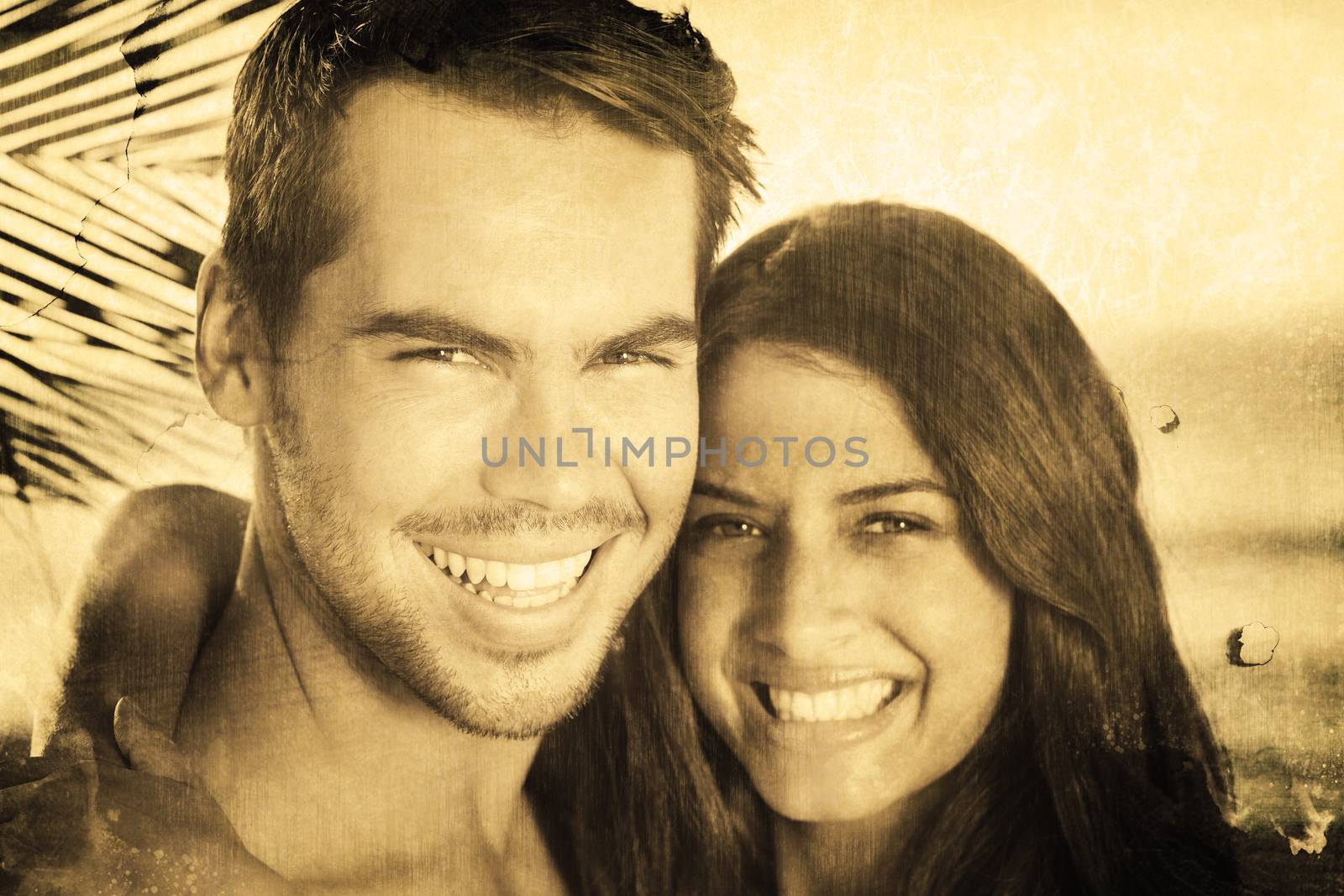 Composite image of cheerful loving couple having holidays by Wavebreakmedia