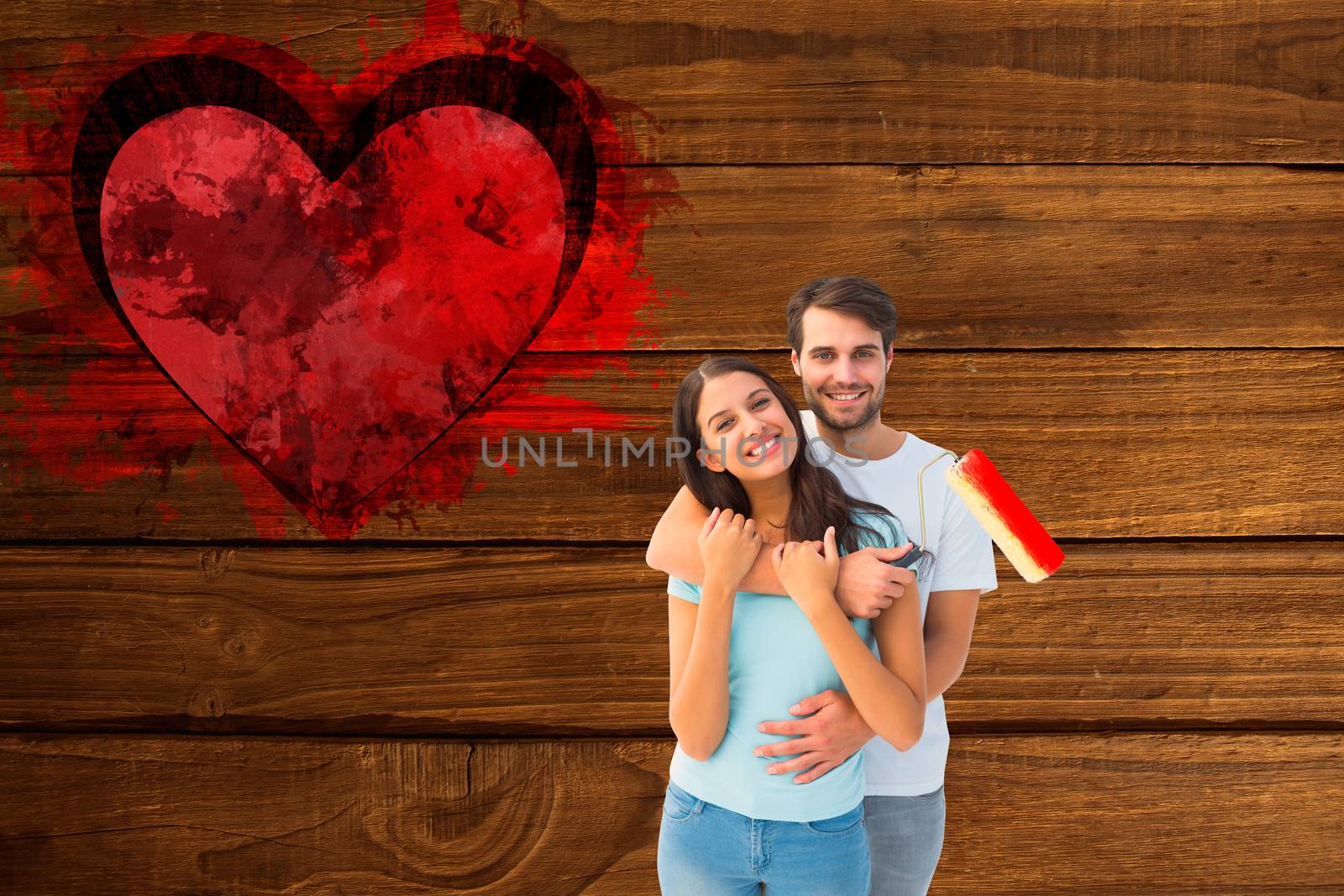 Composite image of happy young couple painting together by Wavebreakmedia