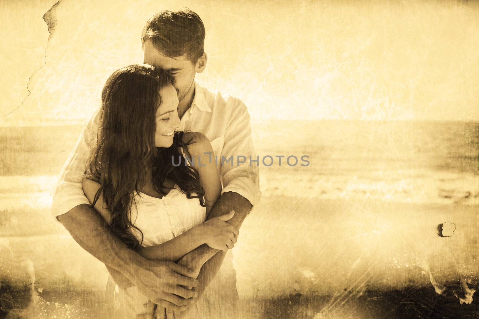 Loving couple cuddling against grey background