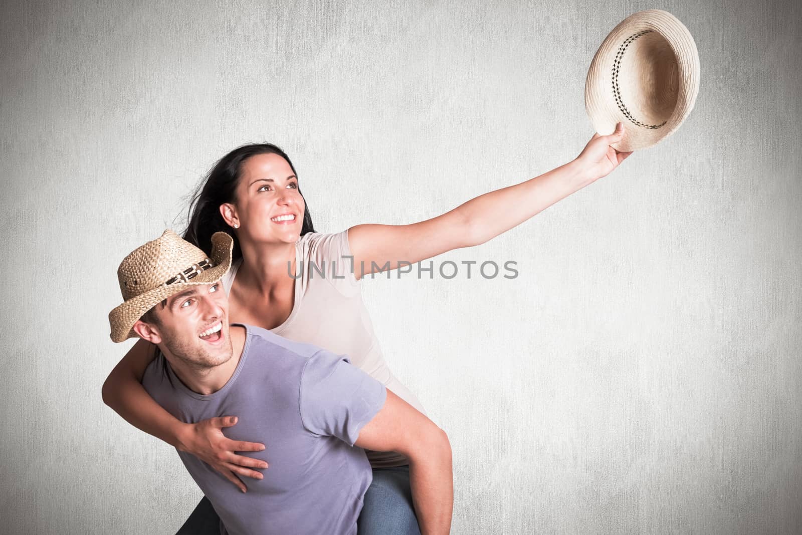 Composite image of man giving his pretty girlfriend a piggy back by Wavebreakmedia