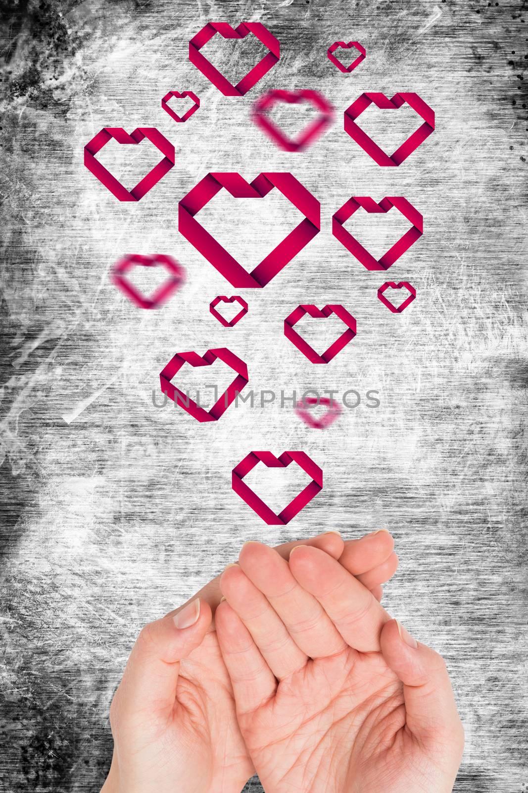 Hands presenting against heart