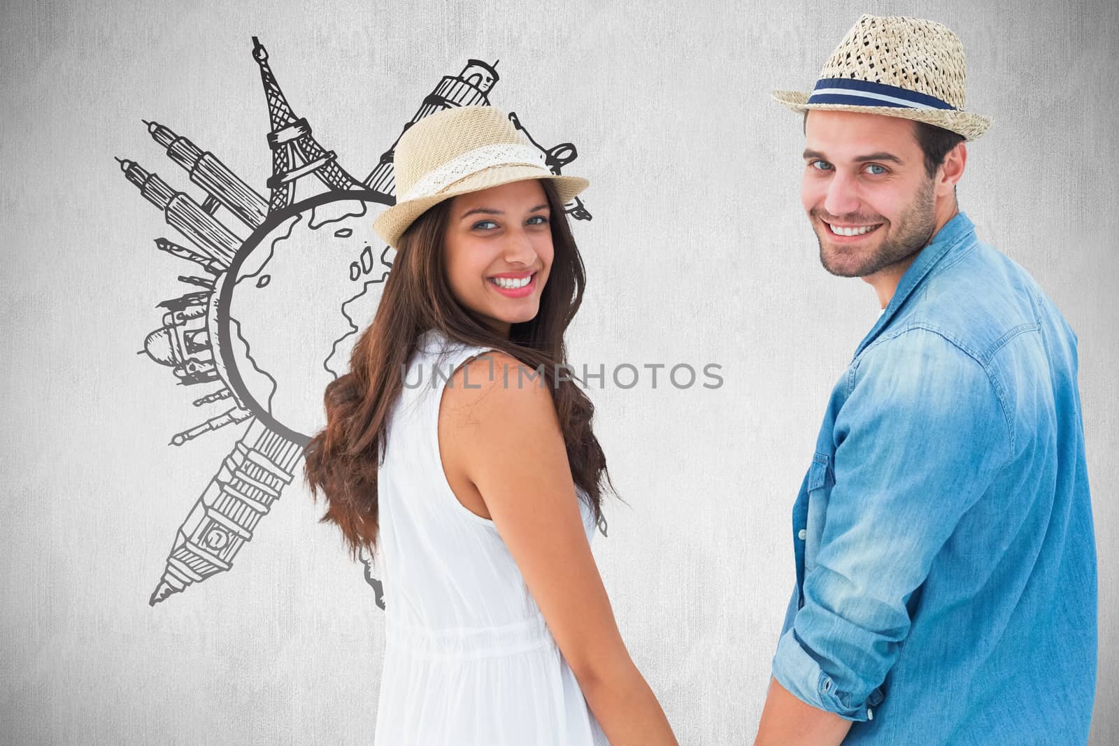Composite image of happy hipster couple holding hands and smiling at camera by Wavebreakmedia