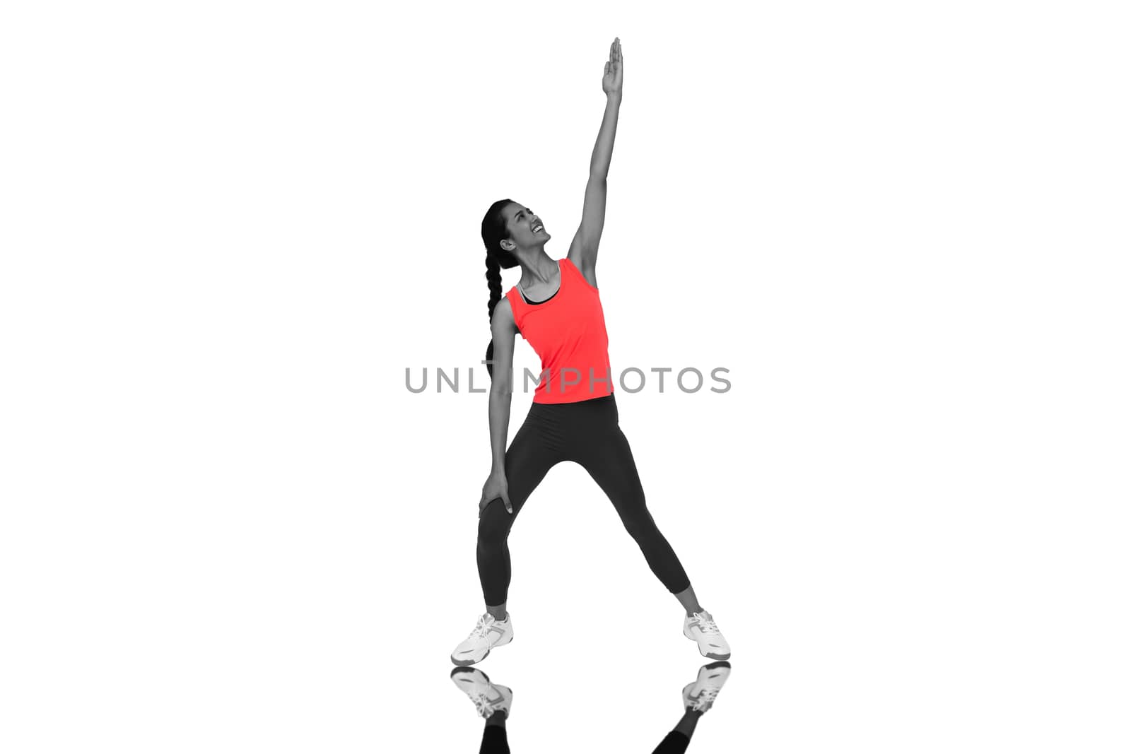 Composite image of full length of a sporty young woman stretching hand by Wavebreakmedia