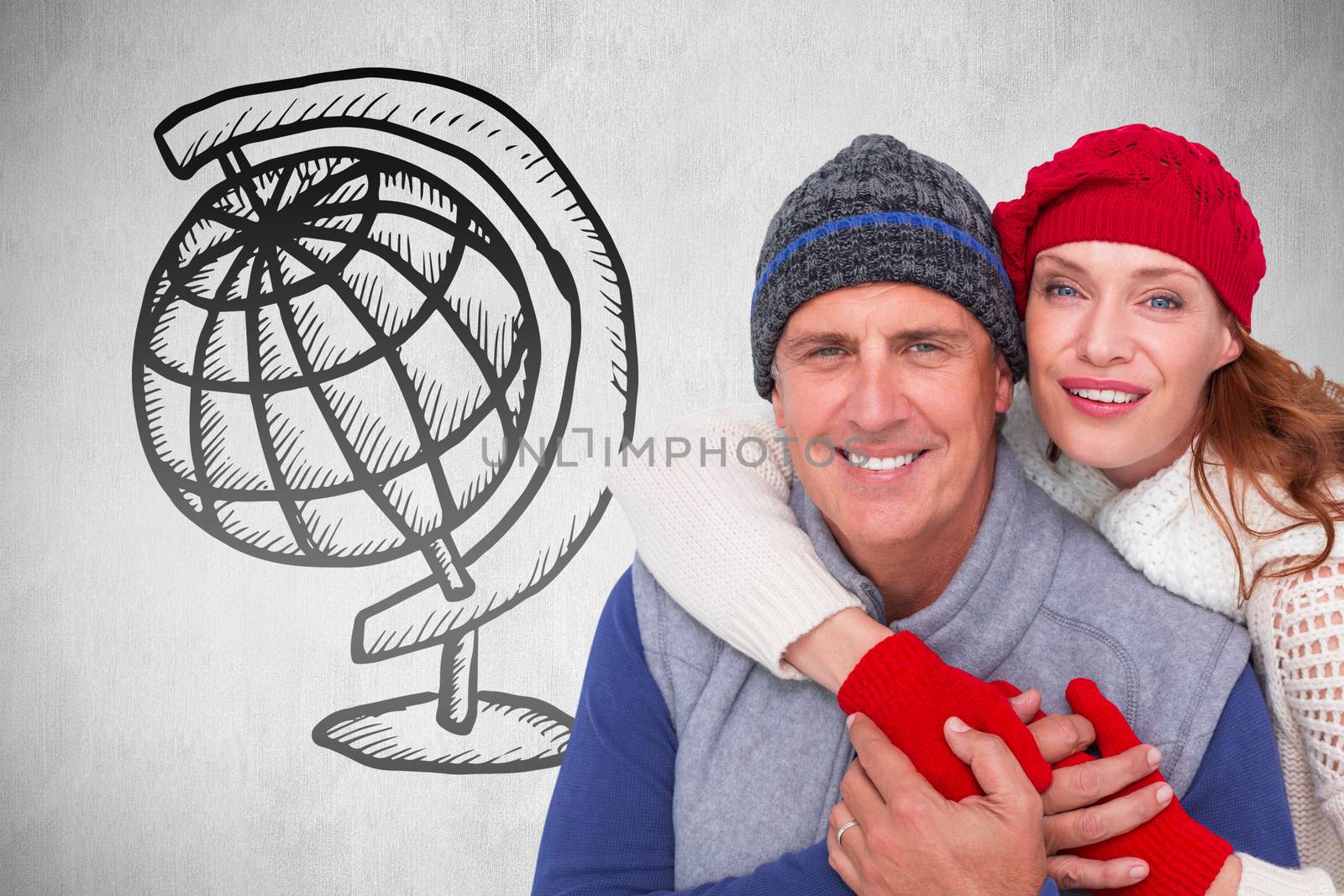 Happy couple in warm clothing against white background