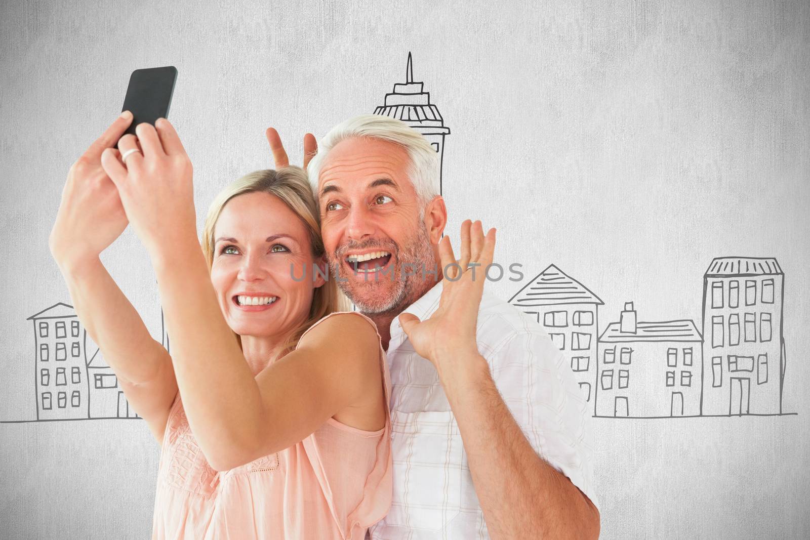 Composite image of happy couple posing for a selfie by Wavebreakmedia