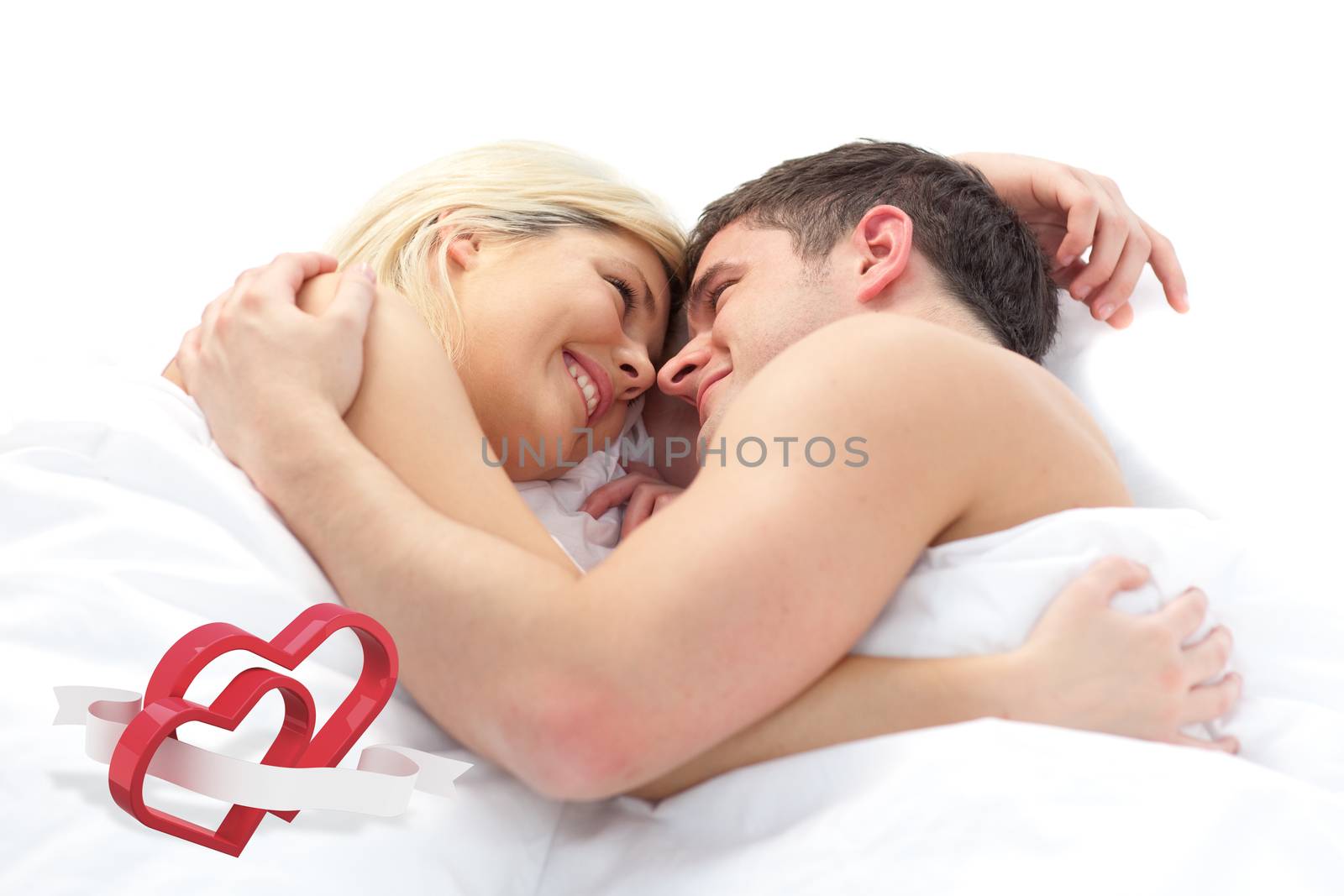 Composite image of loving couple relaxing on bed  by Wavebreakmedia