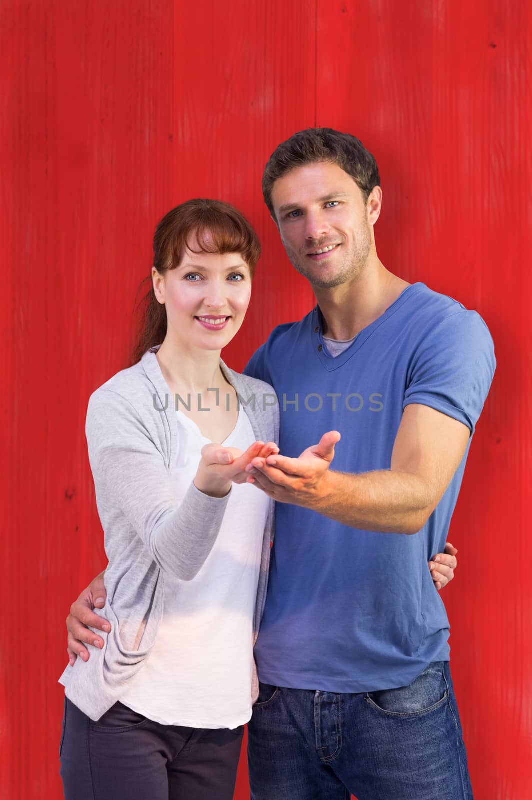 Composite image of couple holding out their hands by Wavebreakmedia