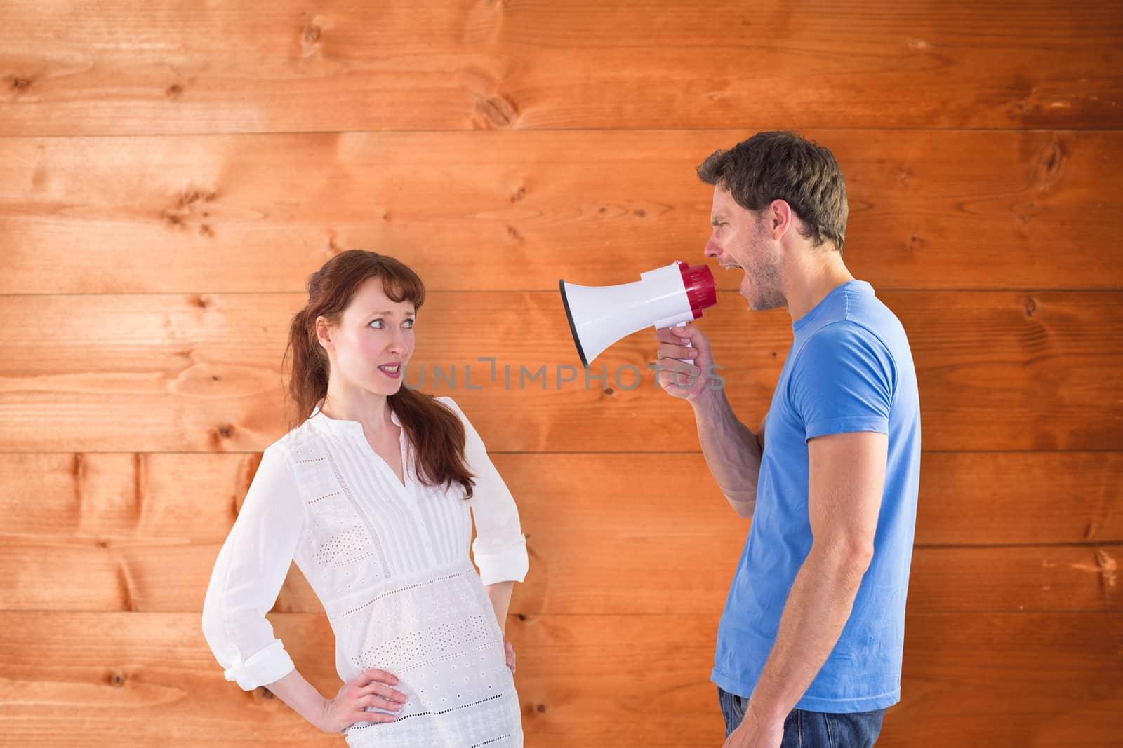 Composite image of man shouting through a megaphone by Wavebreakmedia