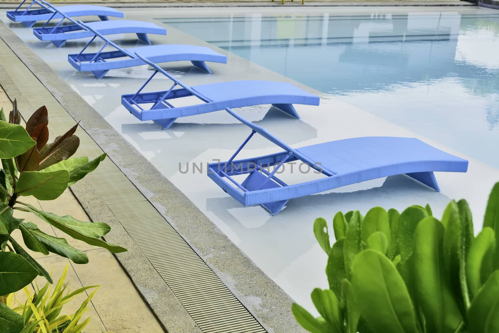 Turquoise pool benches in Philippine hotel