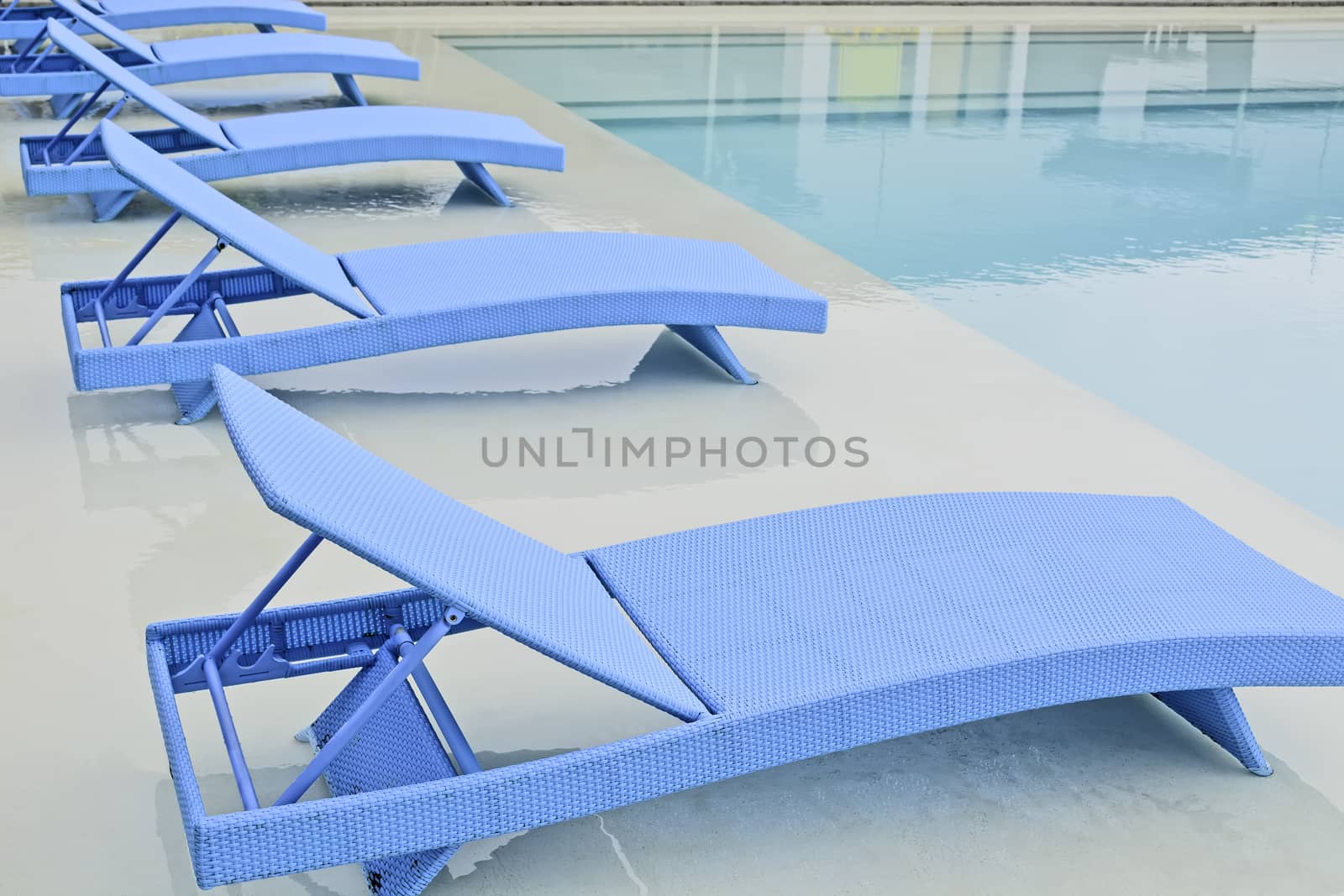 Turquoise pool benches in Philippine hotel
