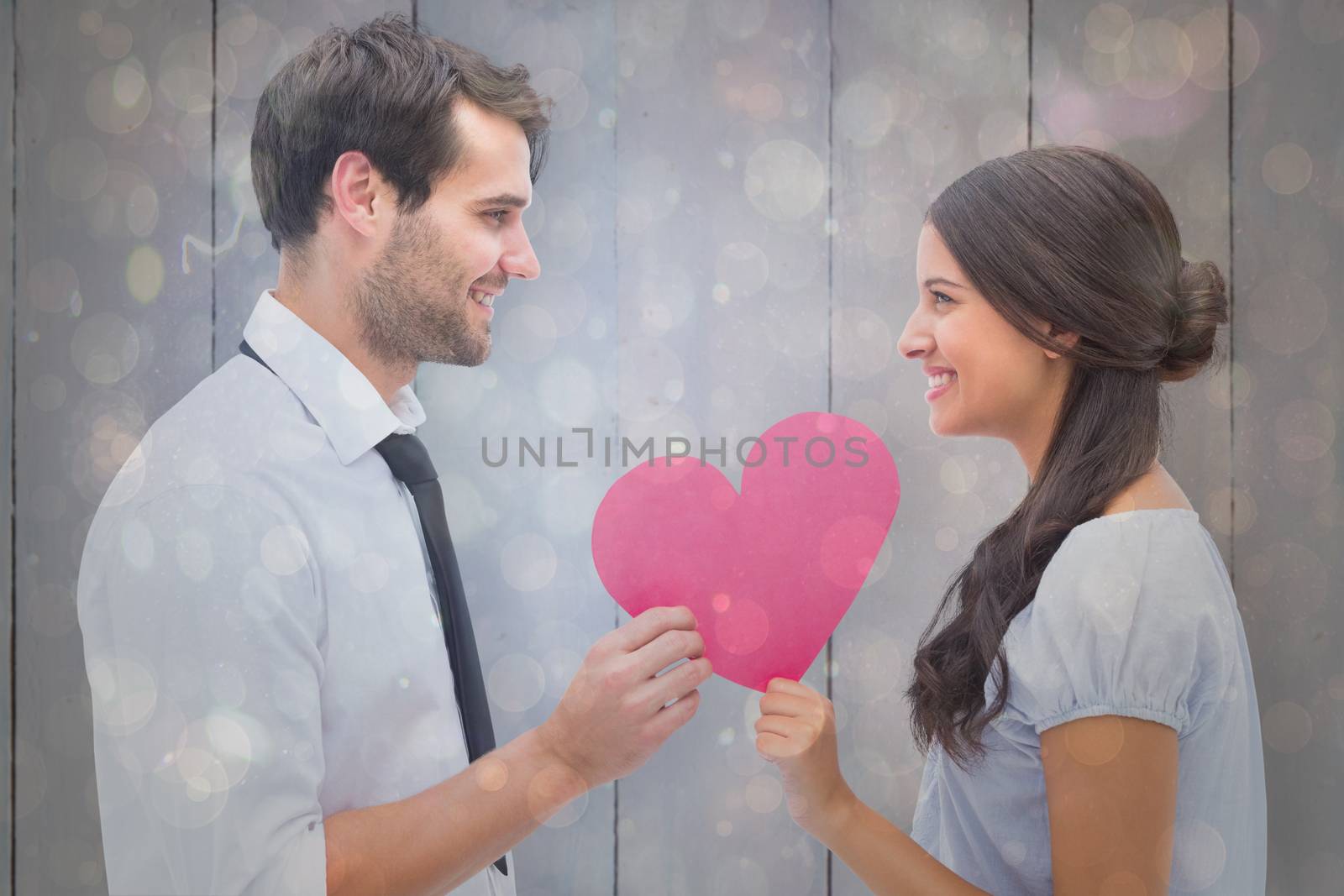 Composite image of pretty brunette giving boyfriend her heart by Wavebreakmedia